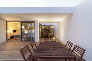 Modern house with garden swimming pool and wooden deck