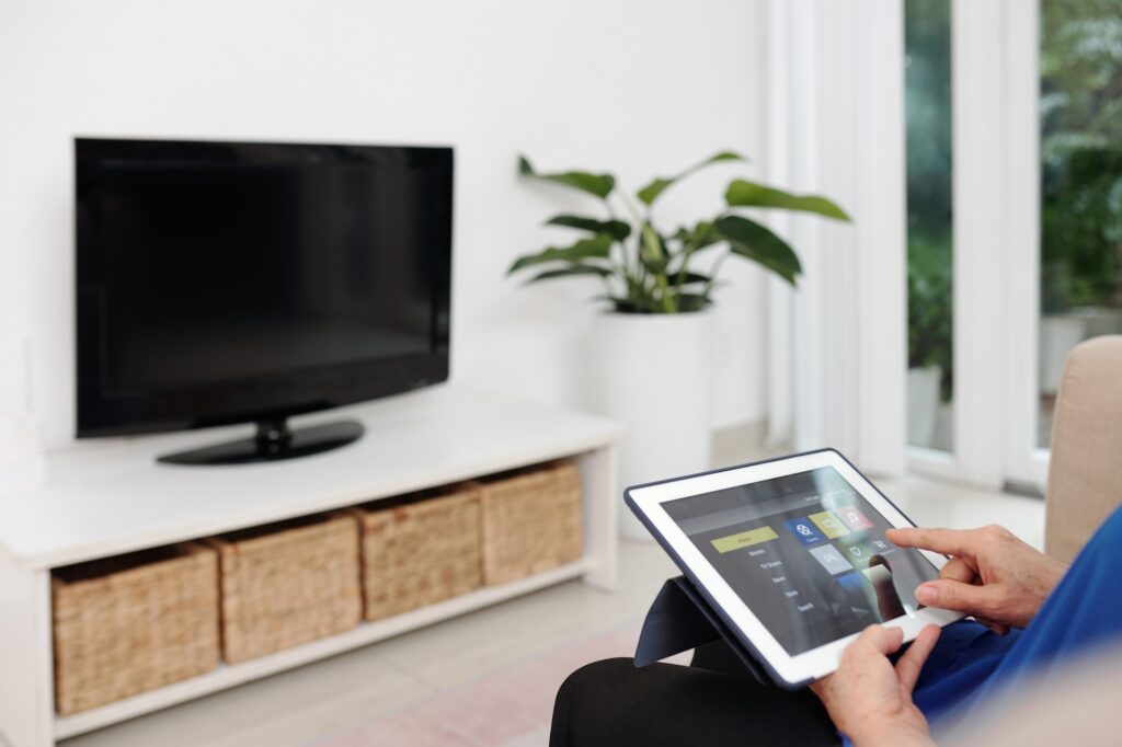 Elderly Woman Using Smart Home App