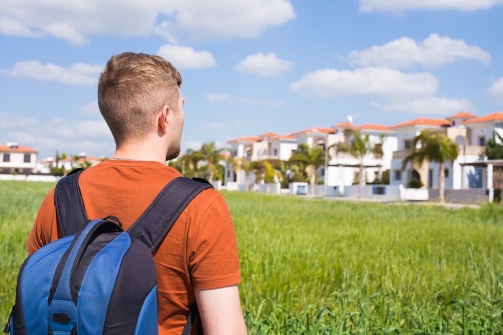 Man looking at a beautiful house to buy