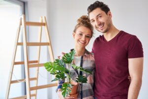 Portrait of smiling owner moving in new flat