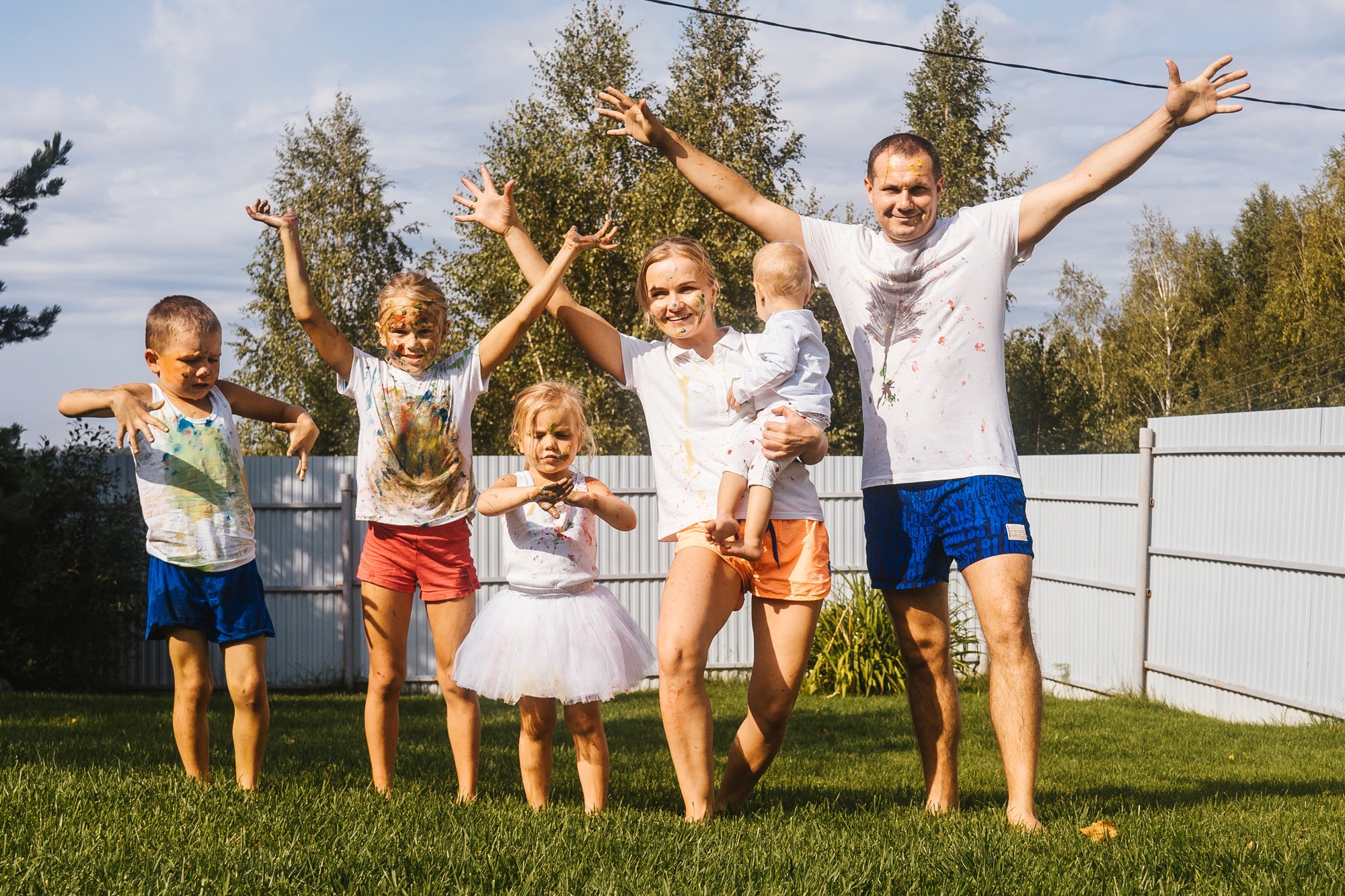 Happy large family with children in garden.