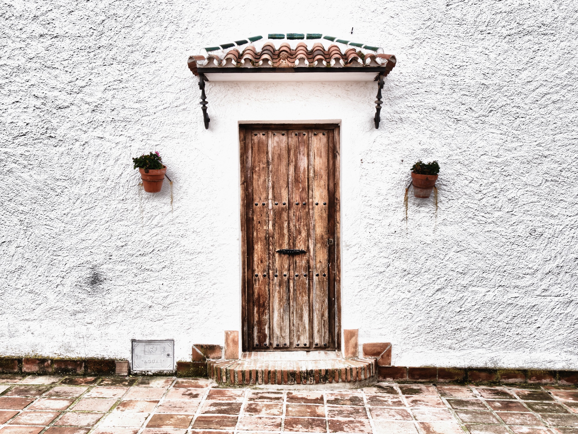 Closeup shot of a white house facade in Frigiliana, Spain