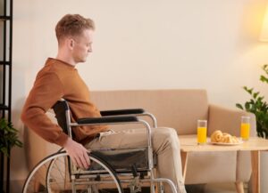 Man in Wheelchair Moving around House