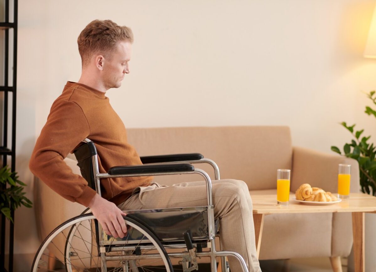 Man in Wheelchair Moving around House