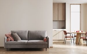Modern clean kitchen interior concept with wooden dinning furniture and gray sofa, Generative AI