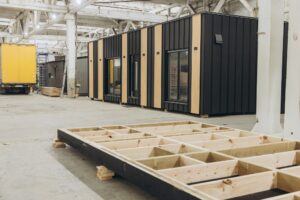 Modular building under construction in a large factory