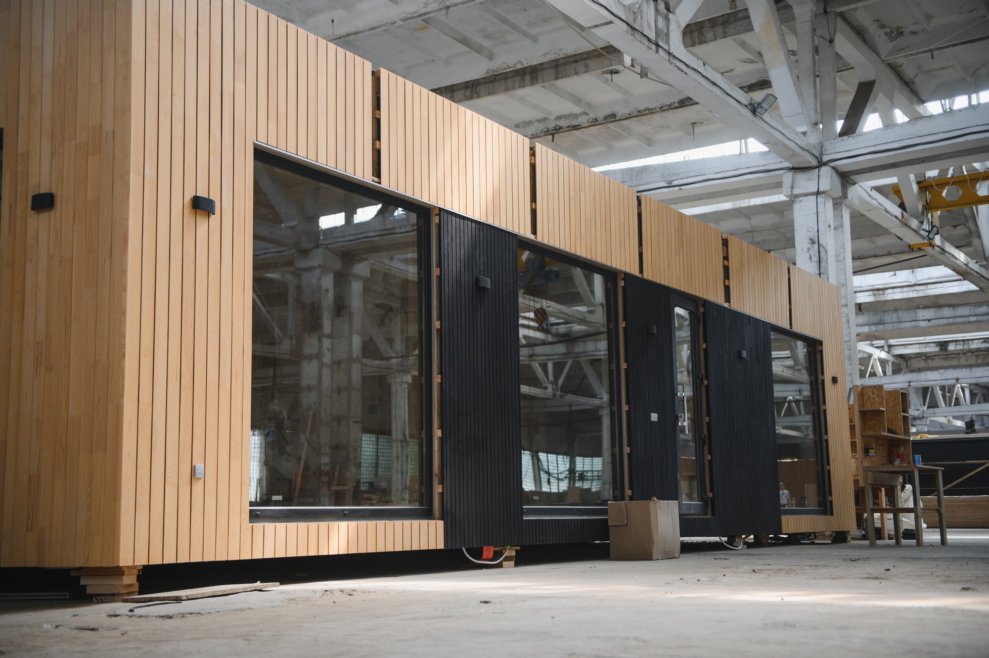 A new wooden modular prefabricated house inside in manufacturing facility